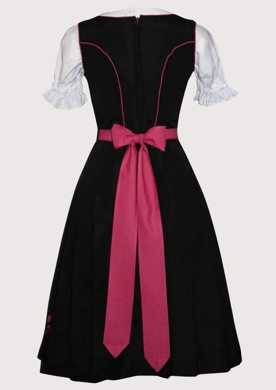 Elegant Oktoberfest Dirndl dress in black and pink featuring floral embroidery, fitted corset bodice, white puff sleeves, and a pleated pink apron.