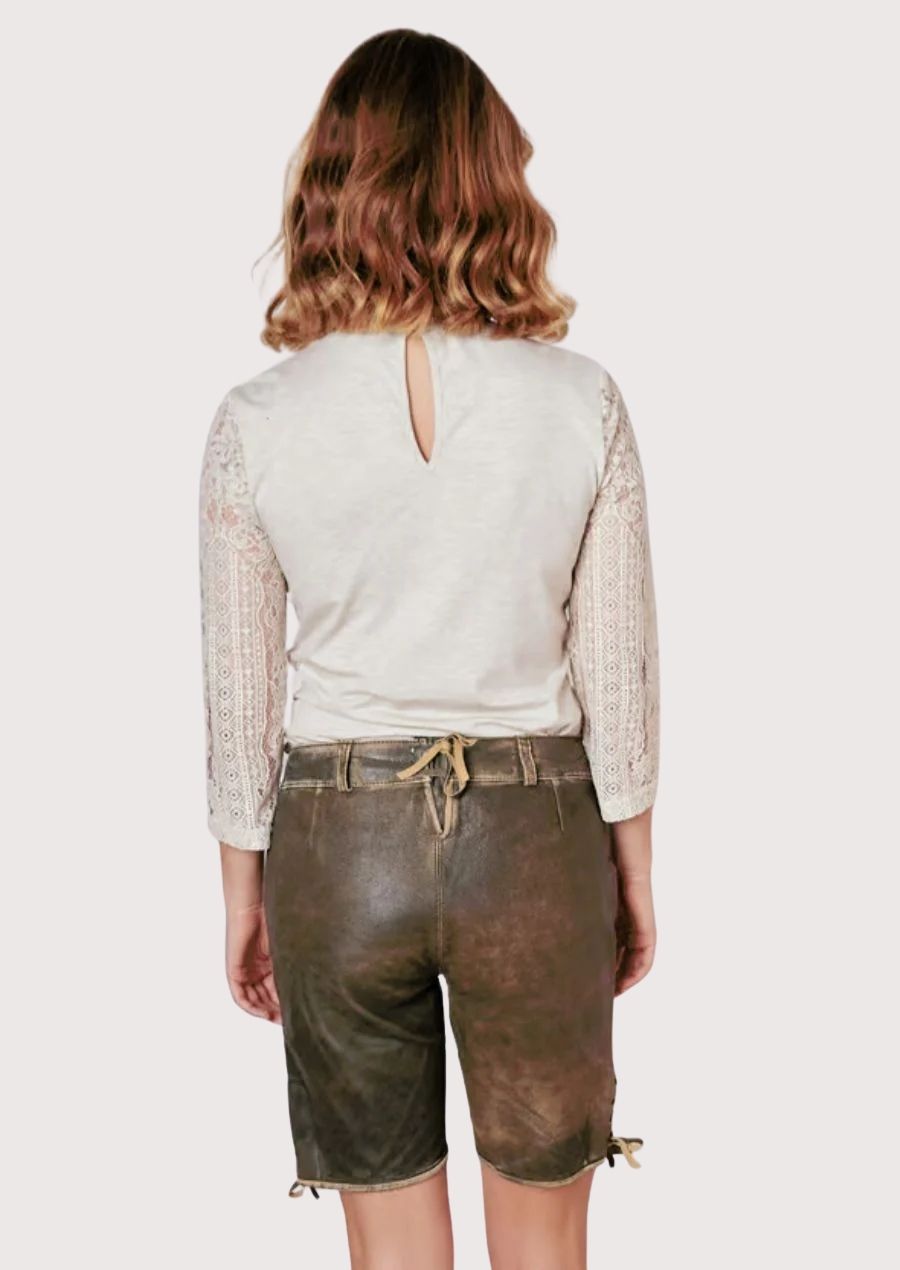 Floral Oktoberfest lederhosen for women crafted from premium brown suede with colorful embroidery and traditional Alpine accents.