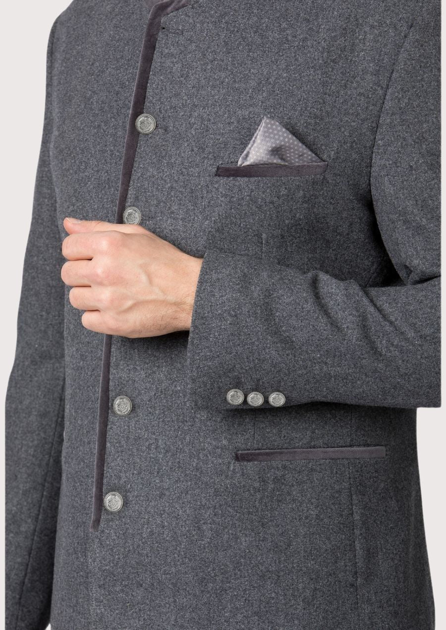 Man wearing a grey Trachten jacket with velvet collar and silver buttons.