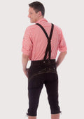 Handcrafted dark brown Bundhosen for men featuring ornate embroidery, adjustable suspenders, and rustic suede texture