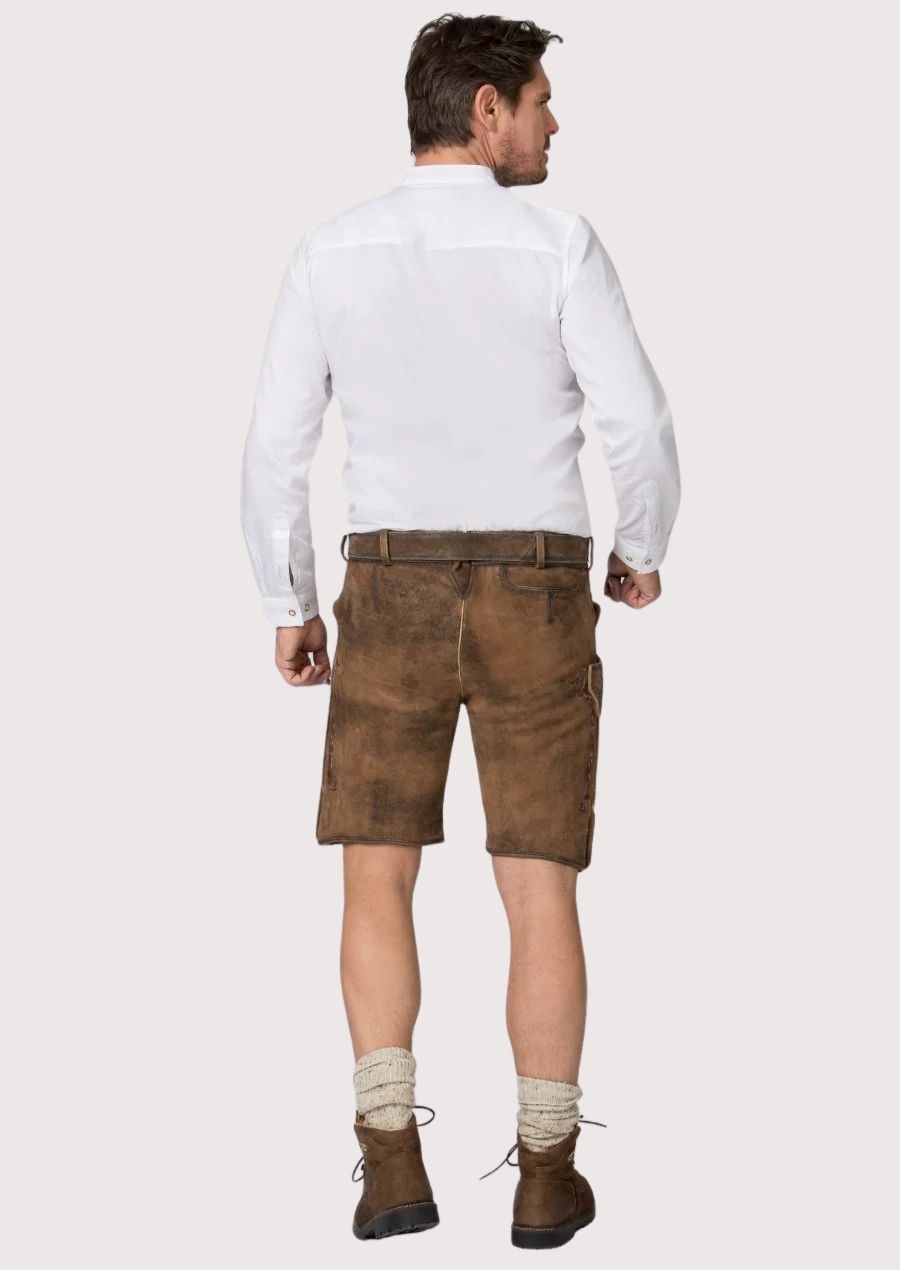 Handcrafted German lederhosen featuring deer embroidery, floral patterns and vintage leather finish