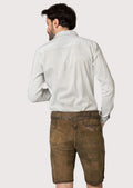 Rustic brown lederhosen featuring embroidered motifs paired with a light striped shirt for timeless Bavarian fashion