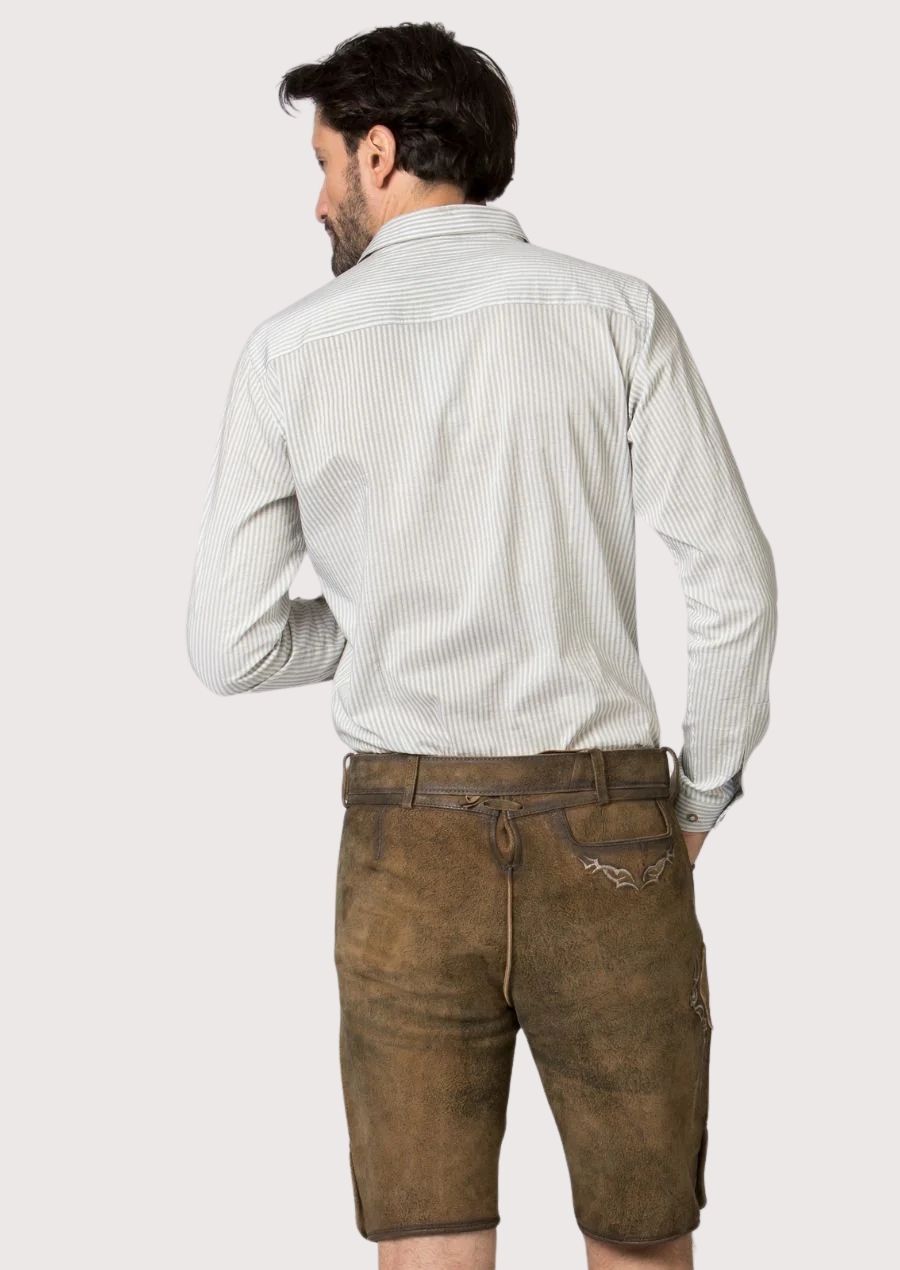 Rustic brown lederhosen featuring embroidered motifs paired with a light striped shirt for timeless Bavarian fashion