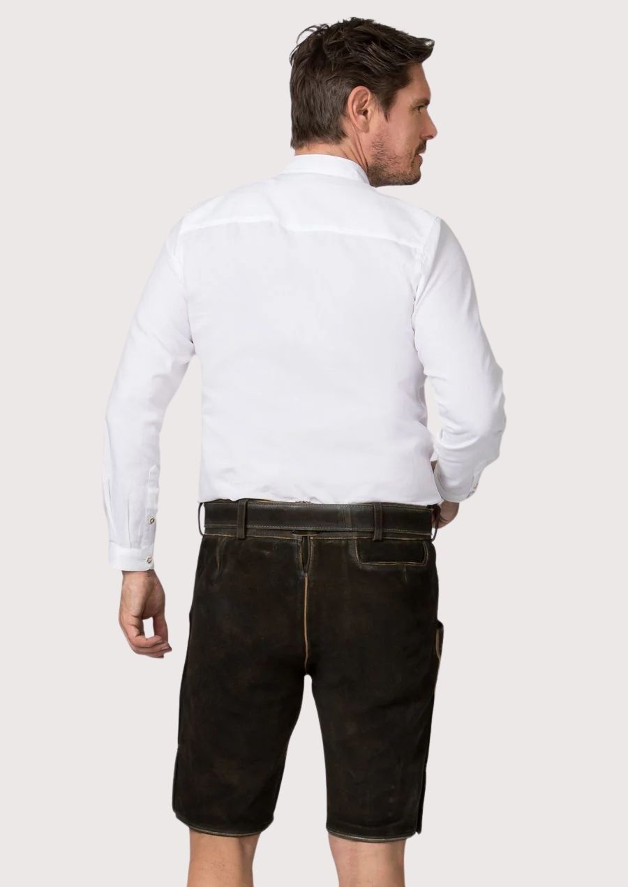 Authentic goatskin suede lederhosen showcasing intricate embroidery and antique-finished leather texture