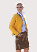 Ladies traditional leather skirt styled with cardigan and blouse