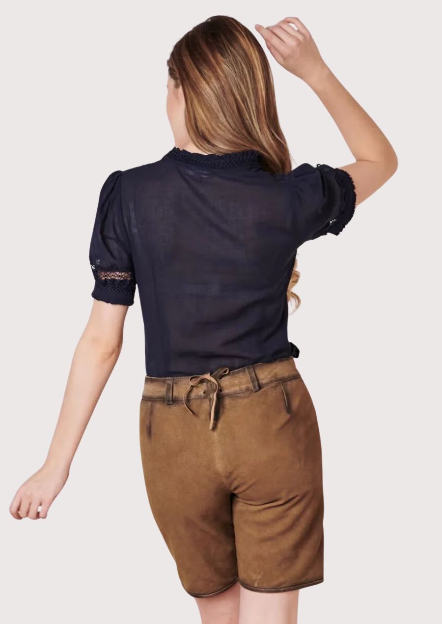 Light brown Bavarian lederhosen for women with ornate embroidery, traditional button accents, and heritage styling.