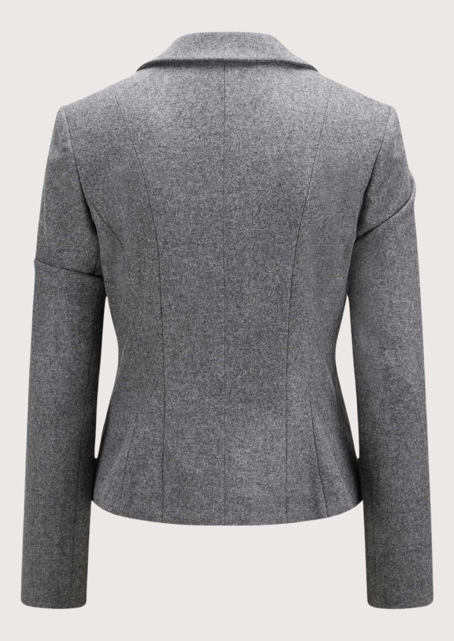 Light grey women’s alpine blazer with tailored waist and decorative buttons.