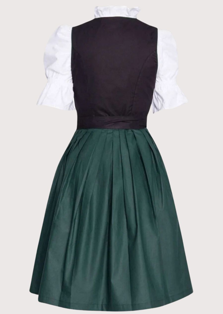Luxury lace-up Dirndl dress with an emerald green bodice, black apron, white blouse, fitted waist, and sophisticated Alpine fashion styling.