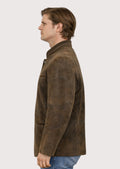 Men’s alpine-style suede leather jacket in rich brown, showcasing a structured silhouette, metal buttons, and timeless traditional appeal.