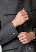 Men’s alpine wool jacket in grey with refined green accent lines.