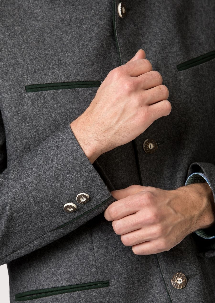 Men’s alpine wool jacket in grey with refined green accent lines.