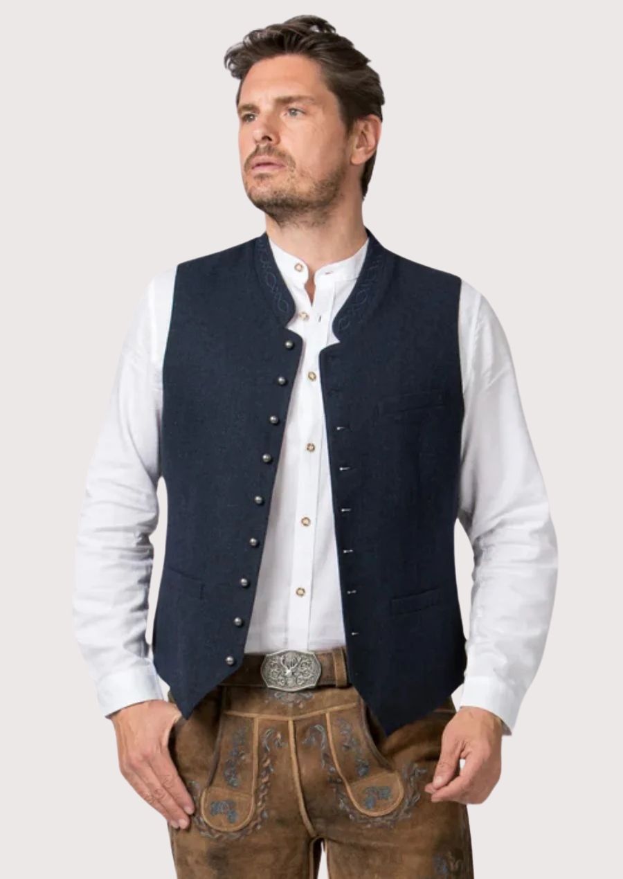 Classic alpine wool vest in deep blue paired with lederhosen