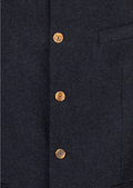 Close-up of buttoned wool Trachten jacket with mandarin collar