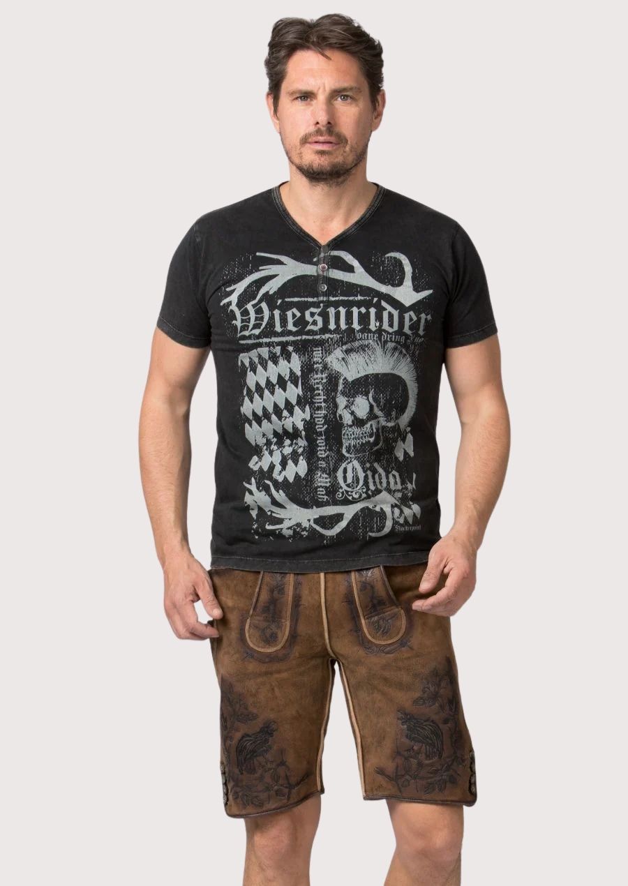 raven hunter heritage lederhosen men with dark embroidered motifs paired with a black skull graphic biker t-shirt for a modern Oktoberfest and Bavarian fashion look