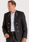 Man wearing a black Trachten jacket with double-breasted metal buttons, white shirt, and classic alpine styling.