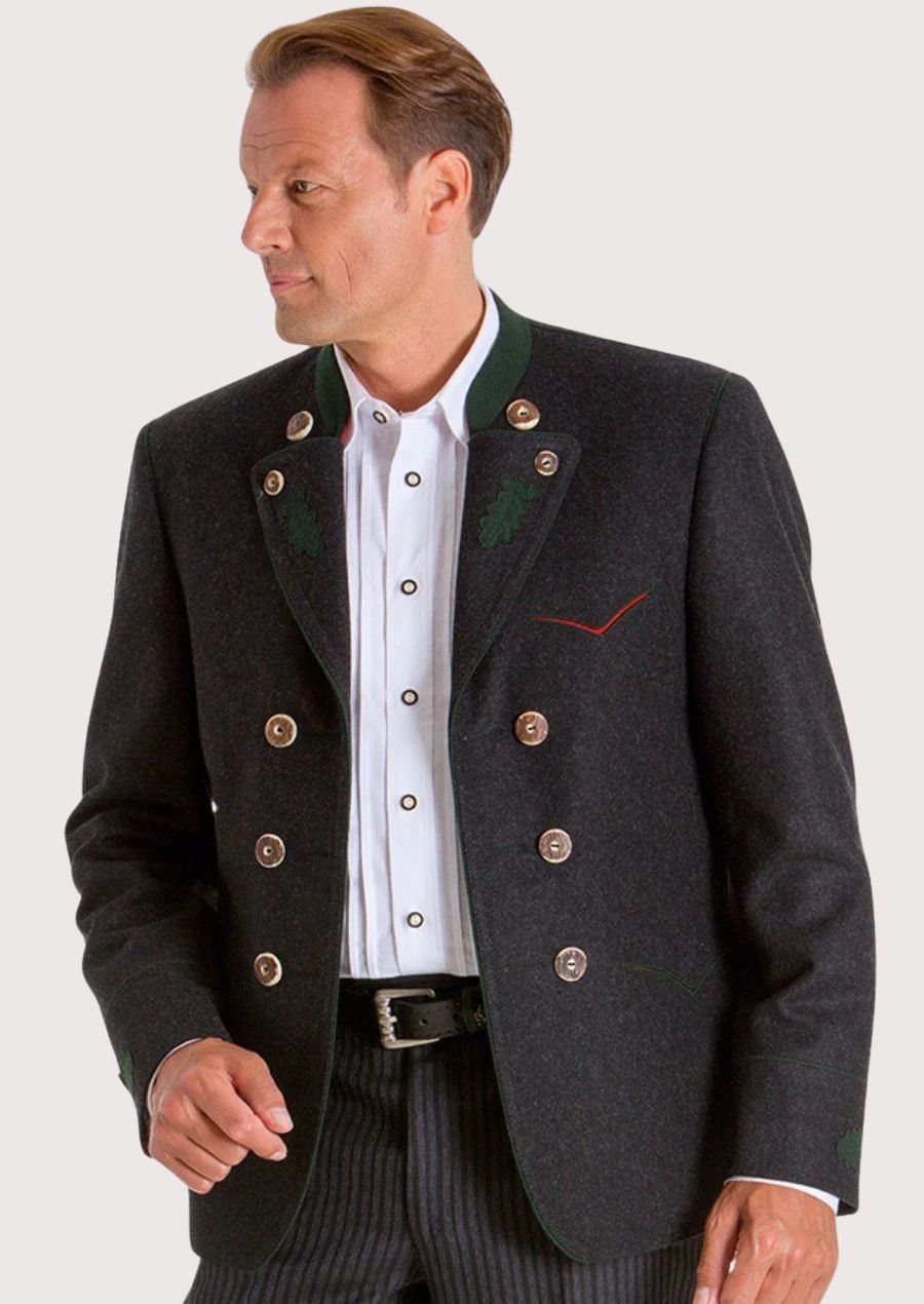 Man wearing a black Trachten jacket with double-breasted metal buttons, white shirt, and classic alpine styling.
