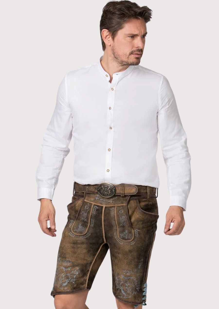 walnut oakleaf suede lederhosen in brown goatskin suede with decorative blue stitching and embossed accents