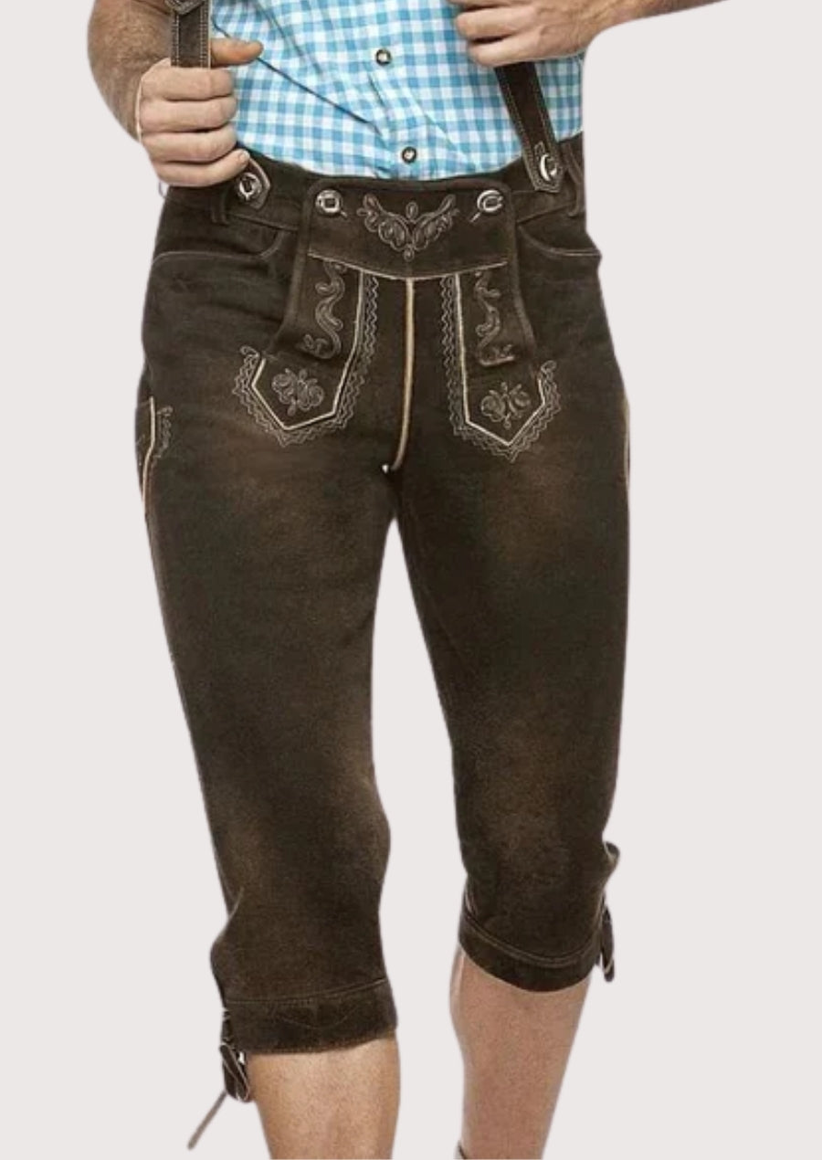 Men wearing traditional brown leather lederhosen with suspenders, fine Alpine embroidery, knee-length cut, and classic Bavarian folk style.