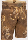 Traditional black leather lederhosen shorts with green embroidered motifs and classic Alpine styling