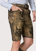 Traditional Bavarian leather shorts showcasing intricate black embroidery and classic folkwear appeal