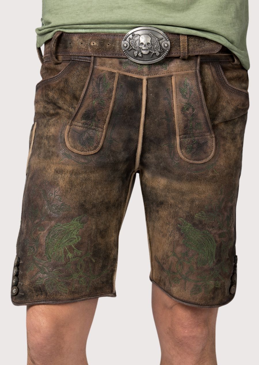 Authentic men's lederhosen with intricate green embroidery for Oktoberfest.

