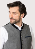 Traditional alpine waistcoat in grey paired with white shirt