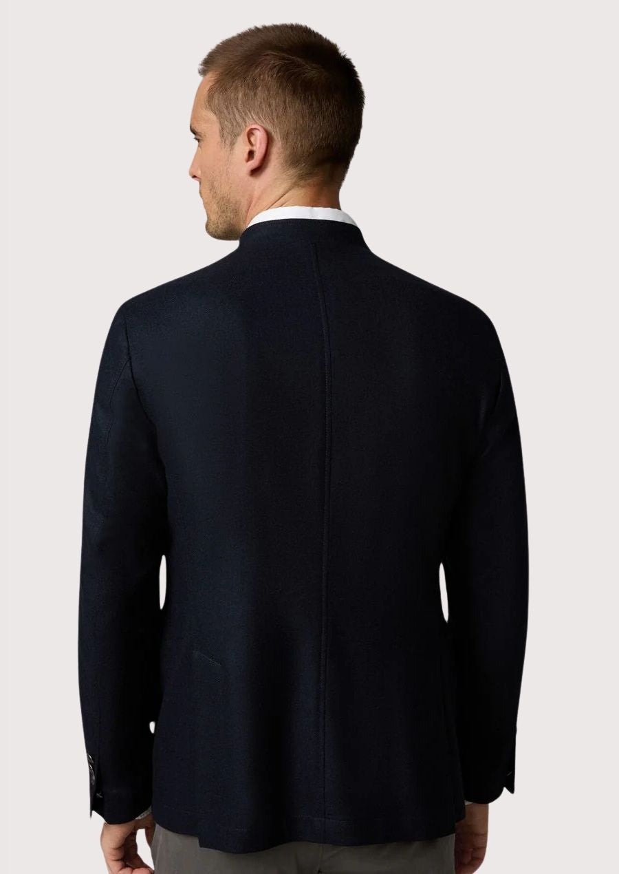 Modern blue stand collar jacket for men with clean tailoring.