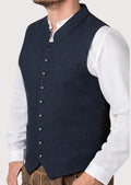 Navy blue Oktoberfest vest with silver buttons worn over white shirt
