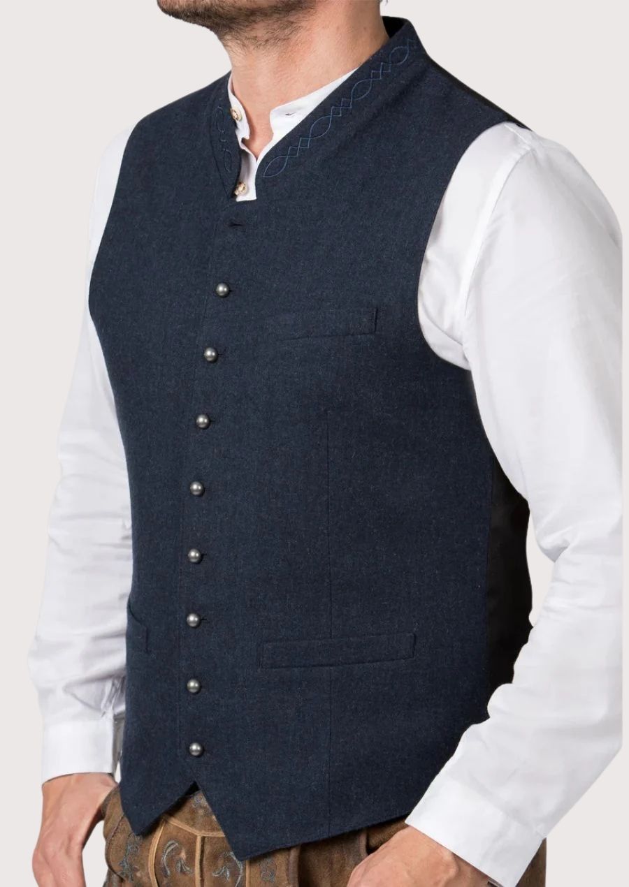 Navy blue Oktoberfest vest with silver buttons worn over white shirt