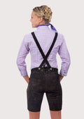 Women's Oktoberfest lederhosen crafted from black suede leather with vibrant purple embroidery and classic Bavarian details.
