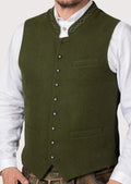 Olive green Bavarian vest worn with white shirt and lederhosen