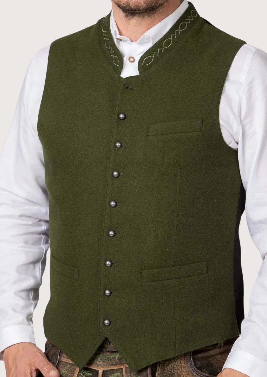Olive green Bavarian vest worn with white shirt and lederhosen
