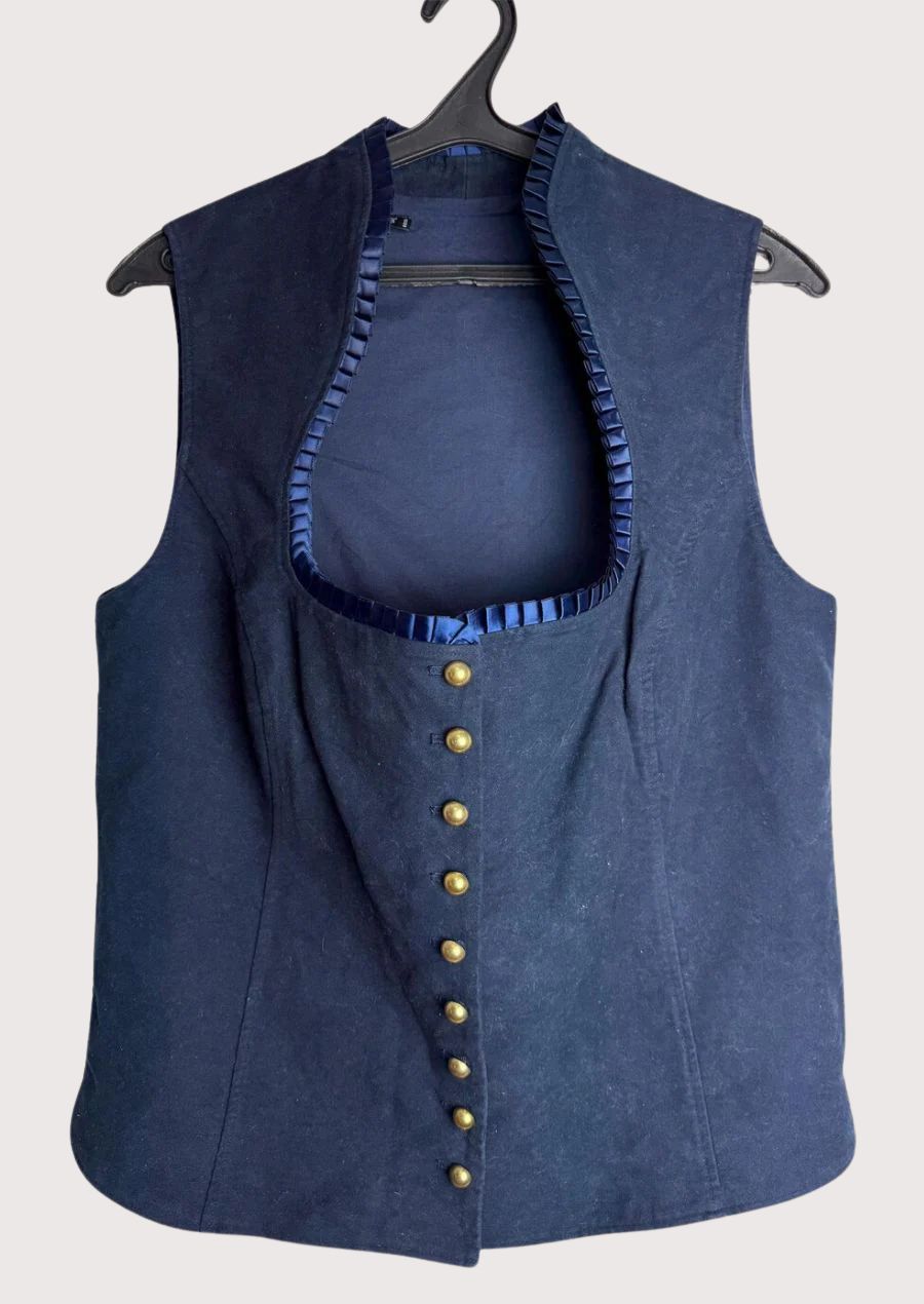 Pleated Trim Trachten Vest featuring tailored craftsmanship, brass buttons, elegant neckline, and traditional Oktoberfest style.