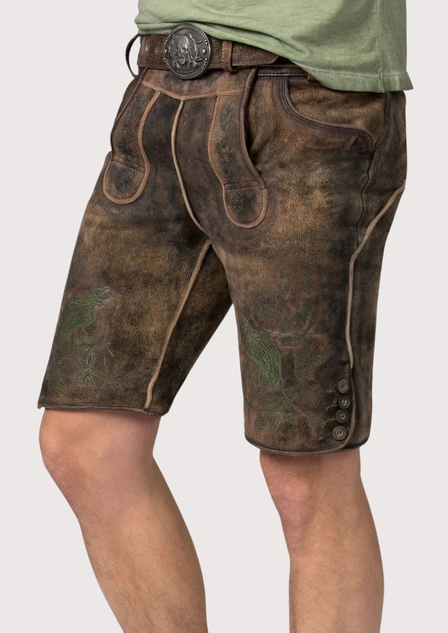 Traditional brown lederhosen shorts showcasing forest-inspired embroidery and authentic craftsmanship
