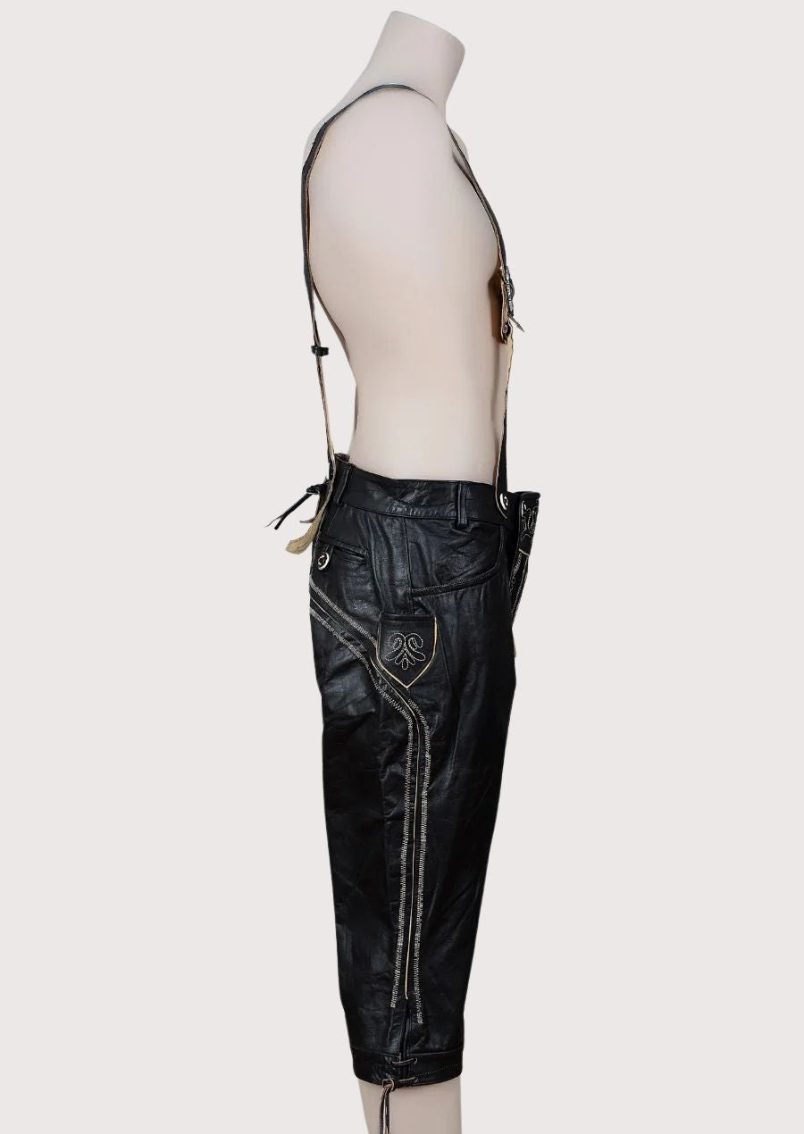 Premium Bavarian Bundhosen in black leather featuring embroidered front flap and adjustable suspenders