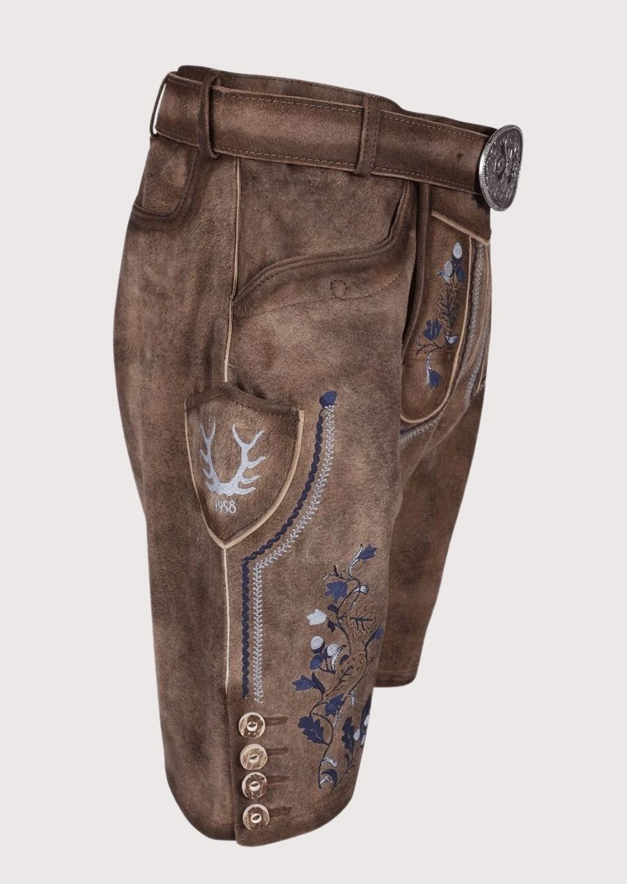 Authentic brown leather lederhosen shorts showcasing blue embroidered floral motifs and Alpine styling