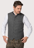 Man wearing a classic Bavarian wool vest in alpine gray

