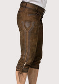 Premium brown kniebund lederhosen with vintage leather finish, adjustable knee closures, and Oktoberfest appeal