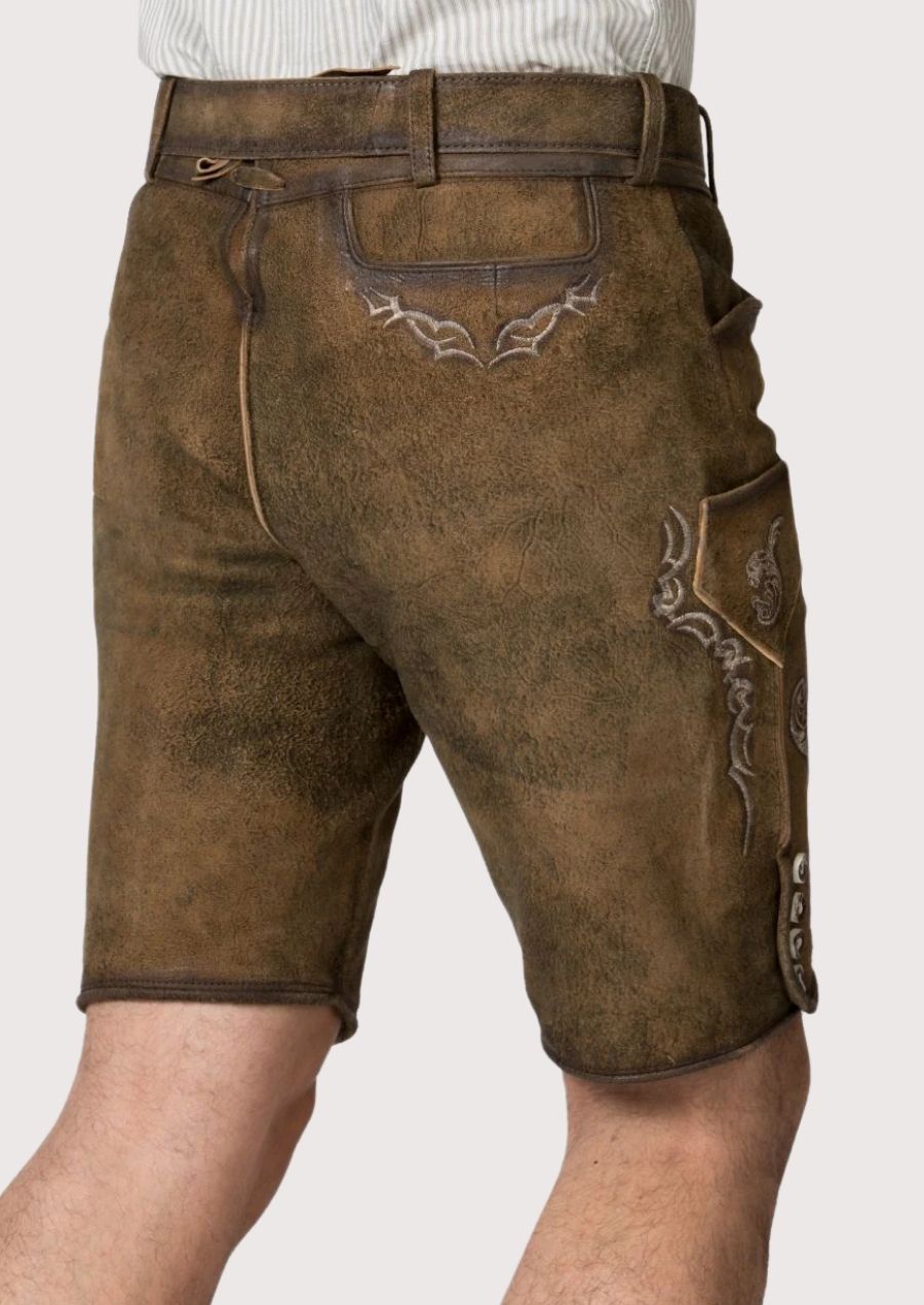 Brown suede lederhosen with decorative embroidery matched with a comfortable striped shirt for Alpine occasions