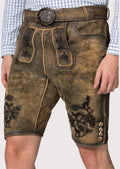 Rustic olive lederhosen crafted from goatskin suede with decorative black embroidery and heritage styling