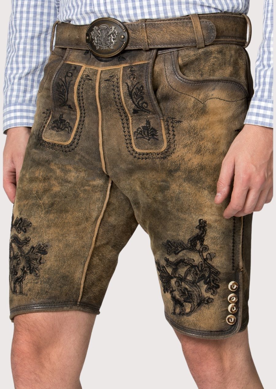 Rustic olive lederhosen crafted from goatskin suede with decorative black embroidery and heritage styling