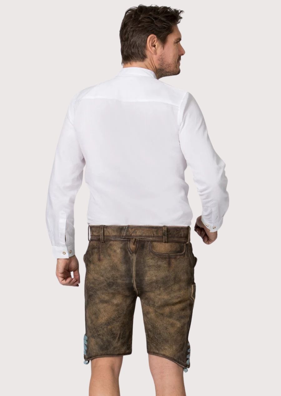 Premium brown lederhosen shorts with intricate blue embroidered motifs and classic Bavarian styling
