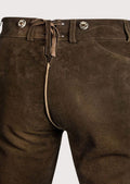 Premium German Bundhosen in rustic goatskin suede paired with embroidered suspenders and Alpine craftsmanship