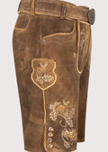 Authentic brown leather lederhosen shorts with embroidered deer accents and classic Alpine styling