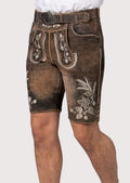 Traditional brown lederhosen shorts with elegant ivory embroidery and heritage-inspired detailing