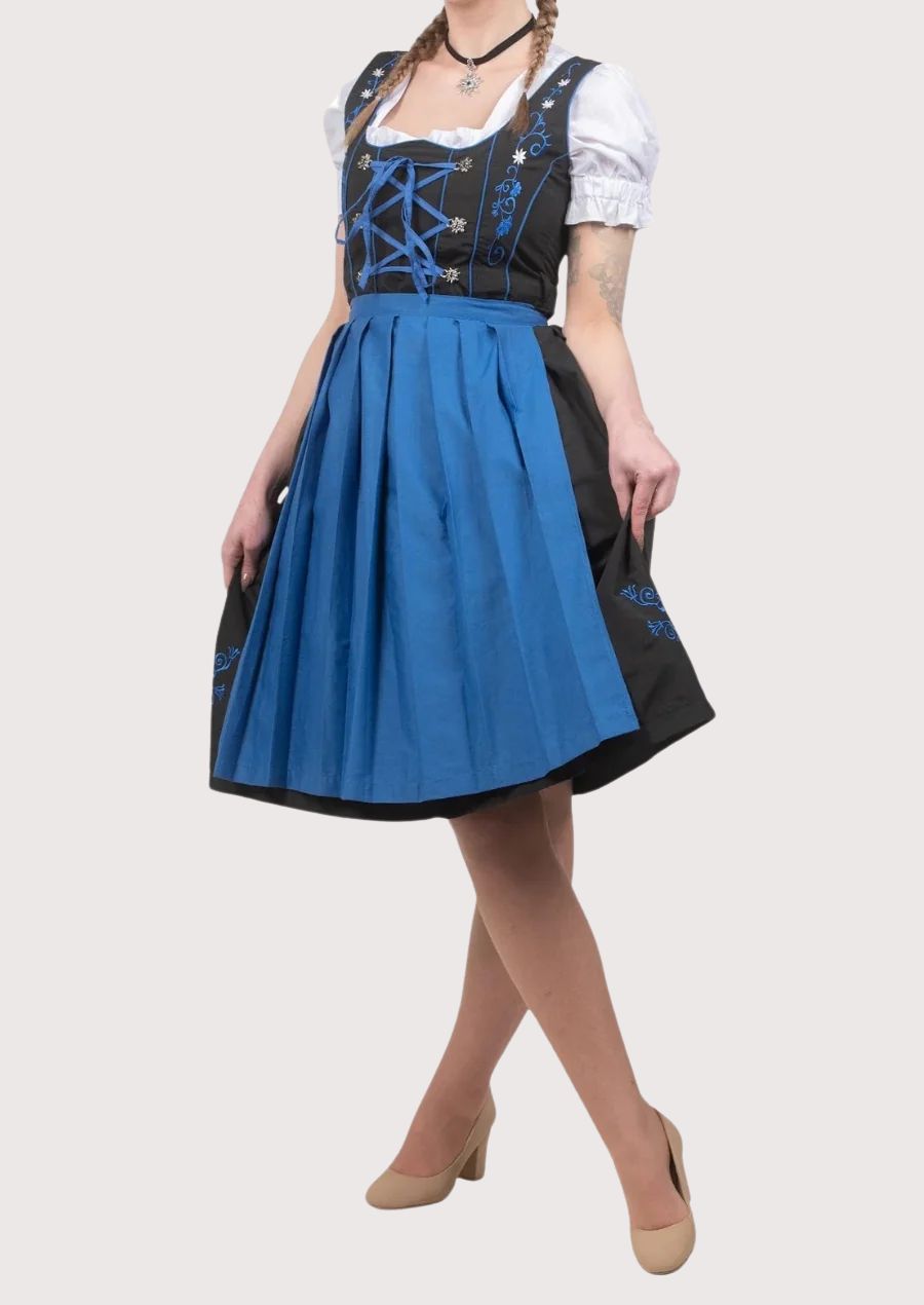 Royal blue and black embroidered Dirndl dress for women with blue apron, lace-up corset bodice, white puff sleeve blouse, traditional Bavarian Oktoberfest outfit, authentic German Alpine clothing.