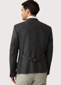 Stylish men's rustic Bavarian jacket with tailored fit, wooden button accents, and satin interior, ideal for cultural festivals.

