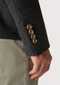 Charcoal grey men's Bavarian jacket with modern fit, wooden buttons, and satin lining for a stylish look at any event.

