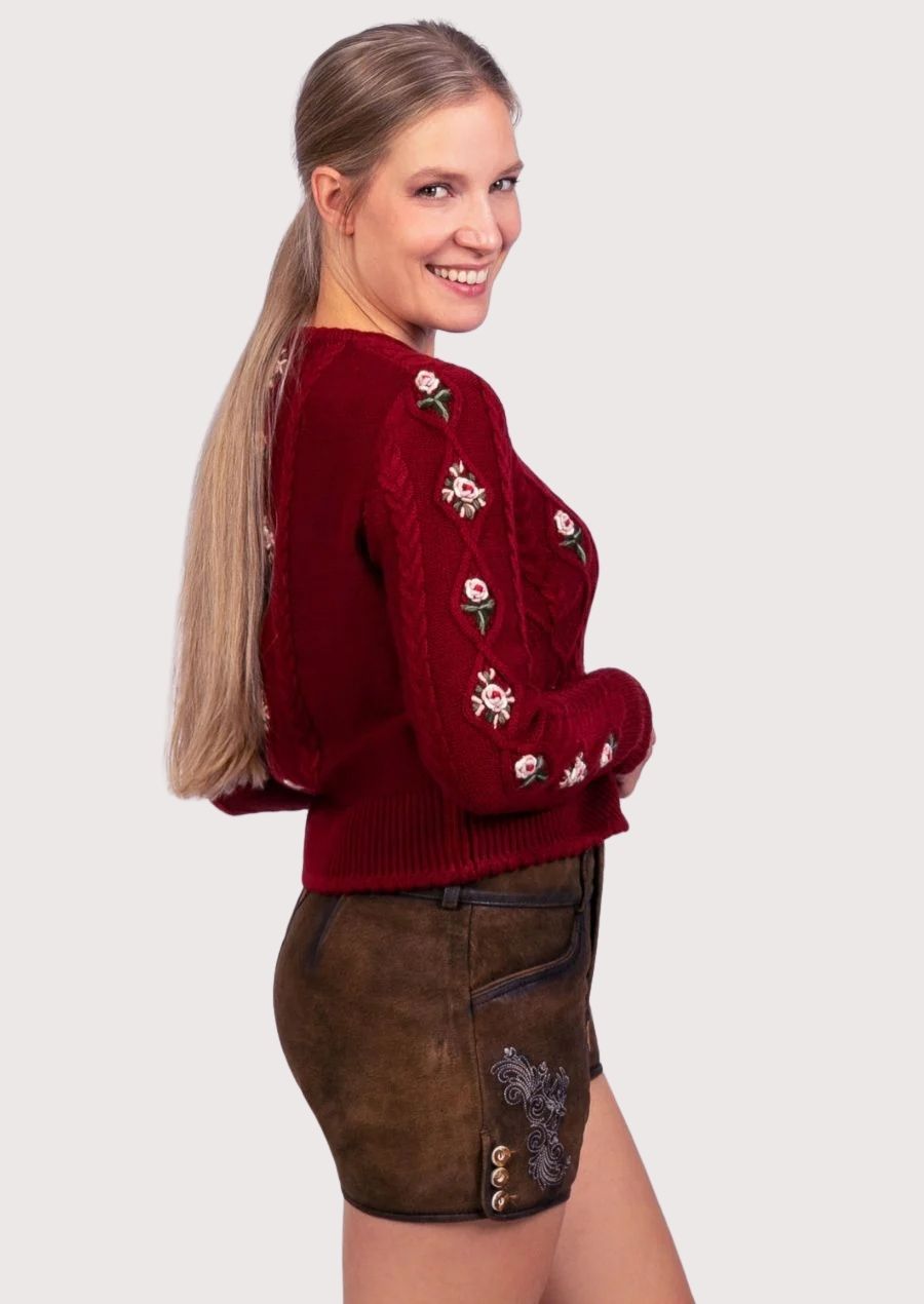 Rustic brown women's lederhosen featuring ornate embroidery, premium suede leather, and timeless Alpine craftsmanship.