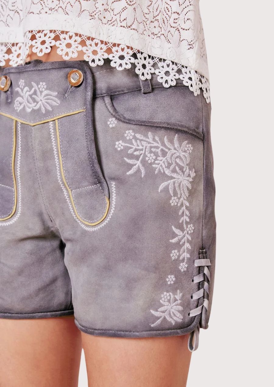 Silver gray Bavarian lederhosen crafted from soft suede with floral embroidery and timeless German heritage appeal.